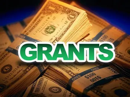 Stacks of money labeled "Grants.