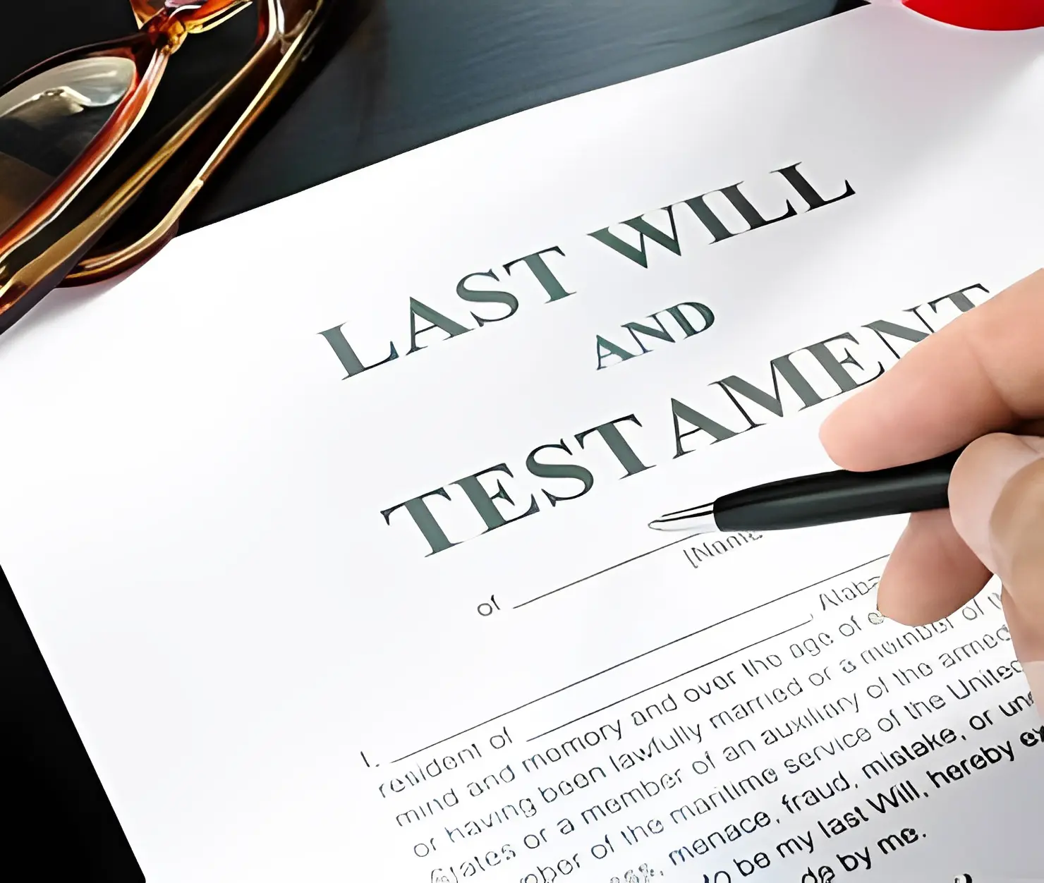 Person signing a last will document.