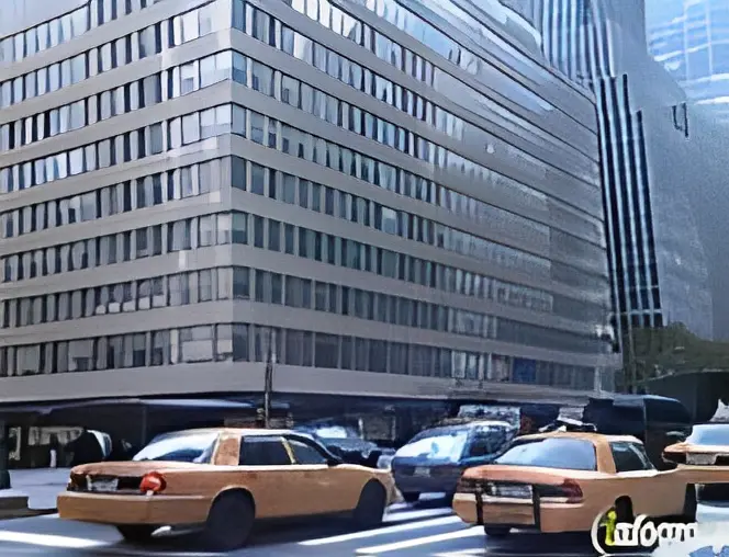 City street with taxis and buildings.