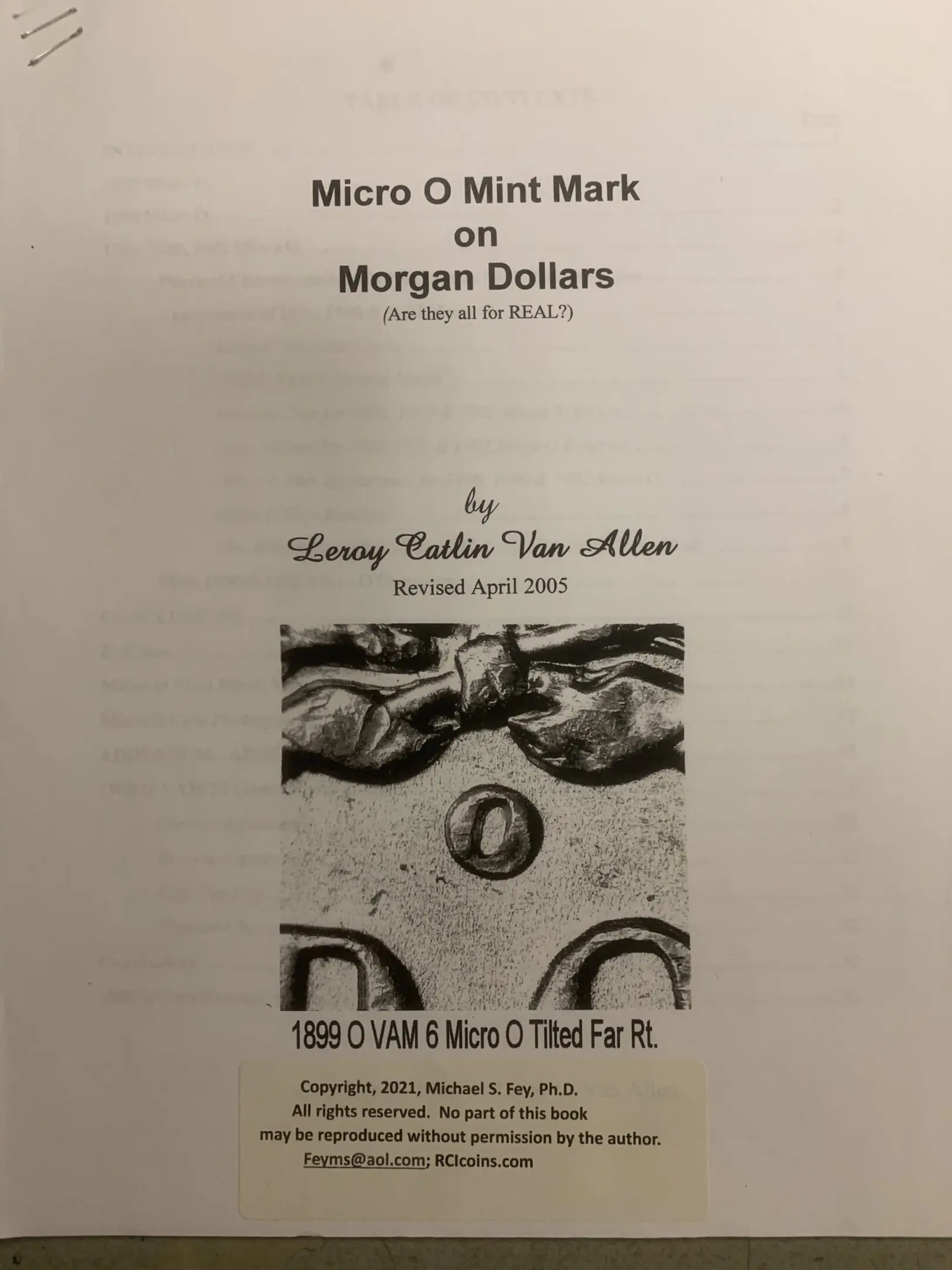 Book page featuring coin mint marks on Morgan Dollars.