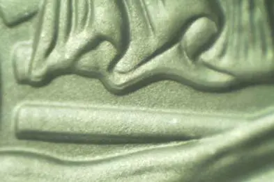Close-up of creamy green swirl texture.