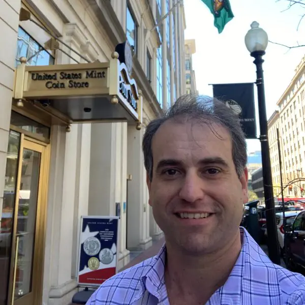 Smiling man outside United States Mint Coin Store