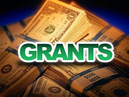 Stacks of money labeled "Grants.