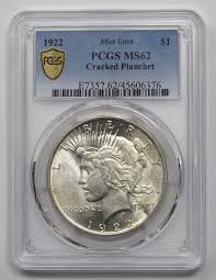 1922 Peace Dollar coin in graded holder.