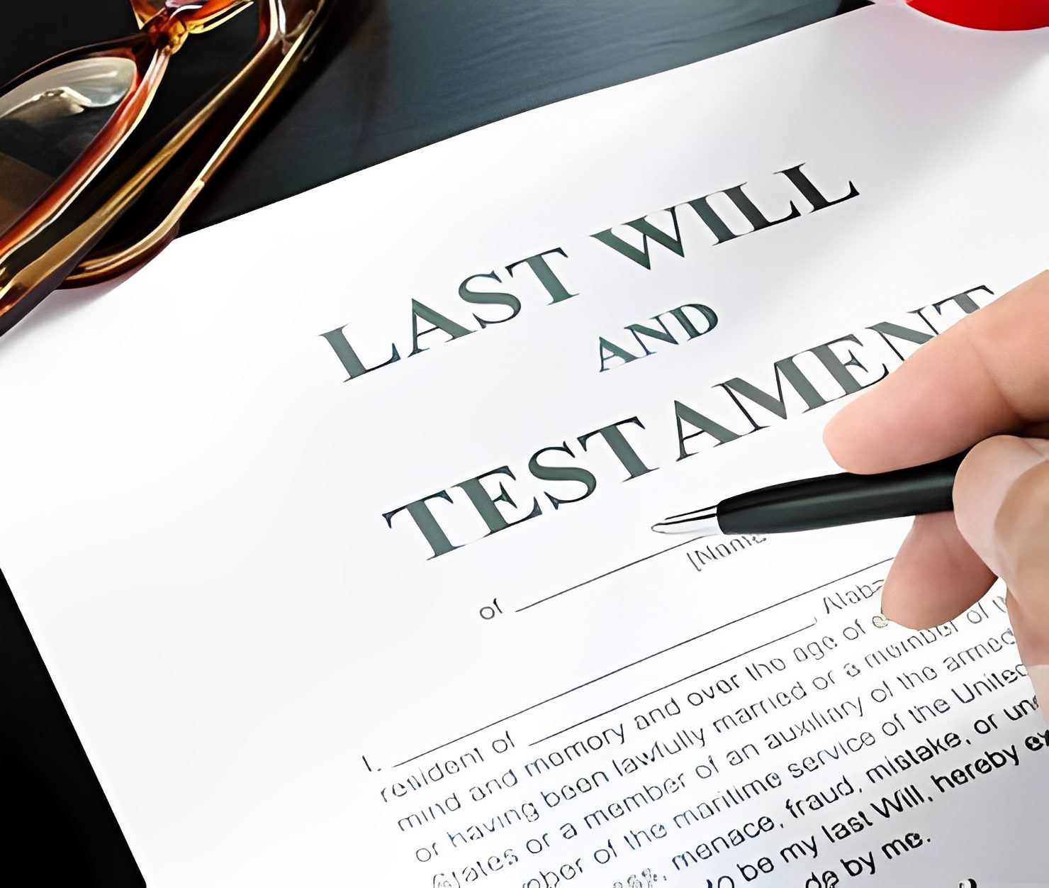 Person signing a last will document.
