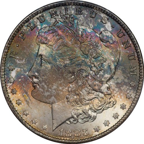 1883 Morgan silver dollar with rainbow toning.