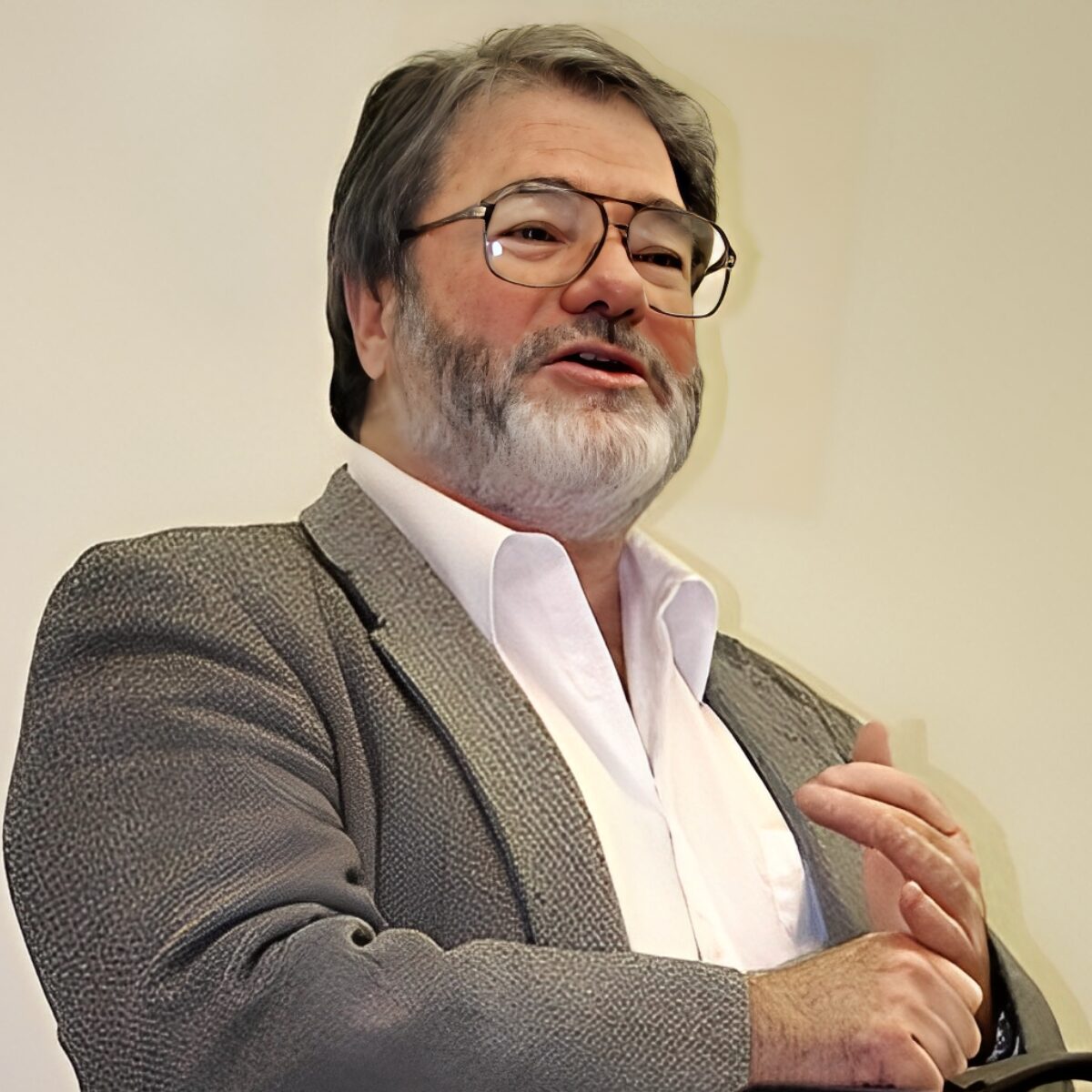 Man speaking with expressive hand gesture.