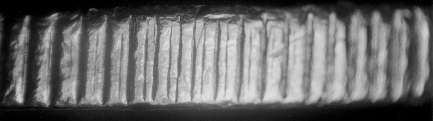 Close-up of a corrugated metal surface.