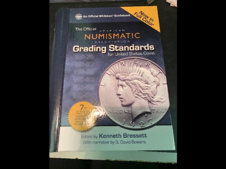 Book: Numismatic Grading Standards, U.S. Coins.