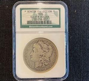 1884 Silver Dollar in protective case.