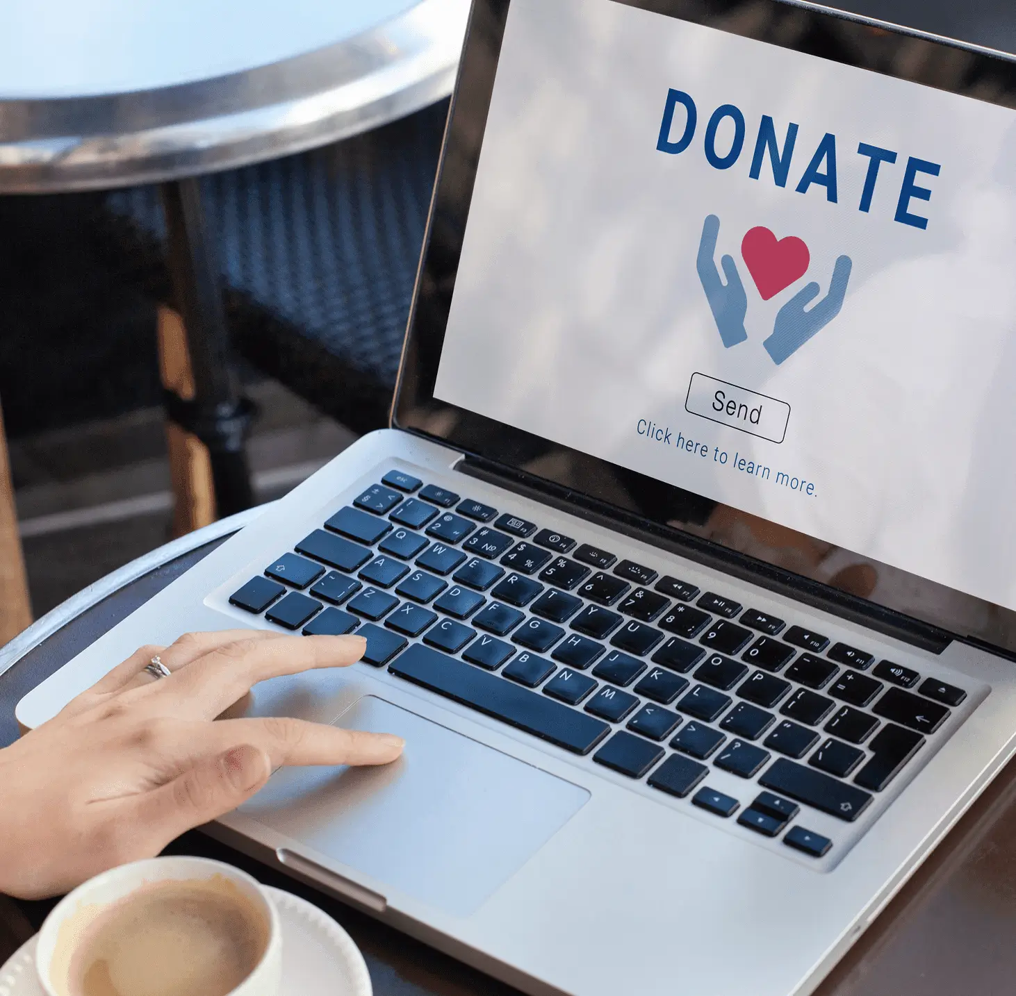 Laptop screen displaying "Donate" with heart icon.